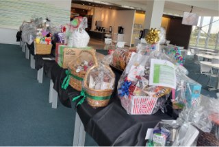 Table with baskets filled with items for the raffle