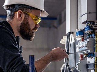 Electrical contractor working on switches 