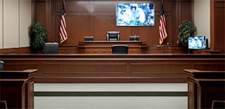 courtroom with video monitor at the front of the room