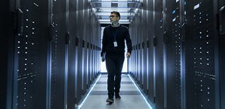 A person walking through a server room
