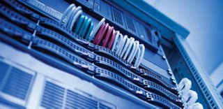 A close-up view of high-speed fiber links inside a data center cabinet.