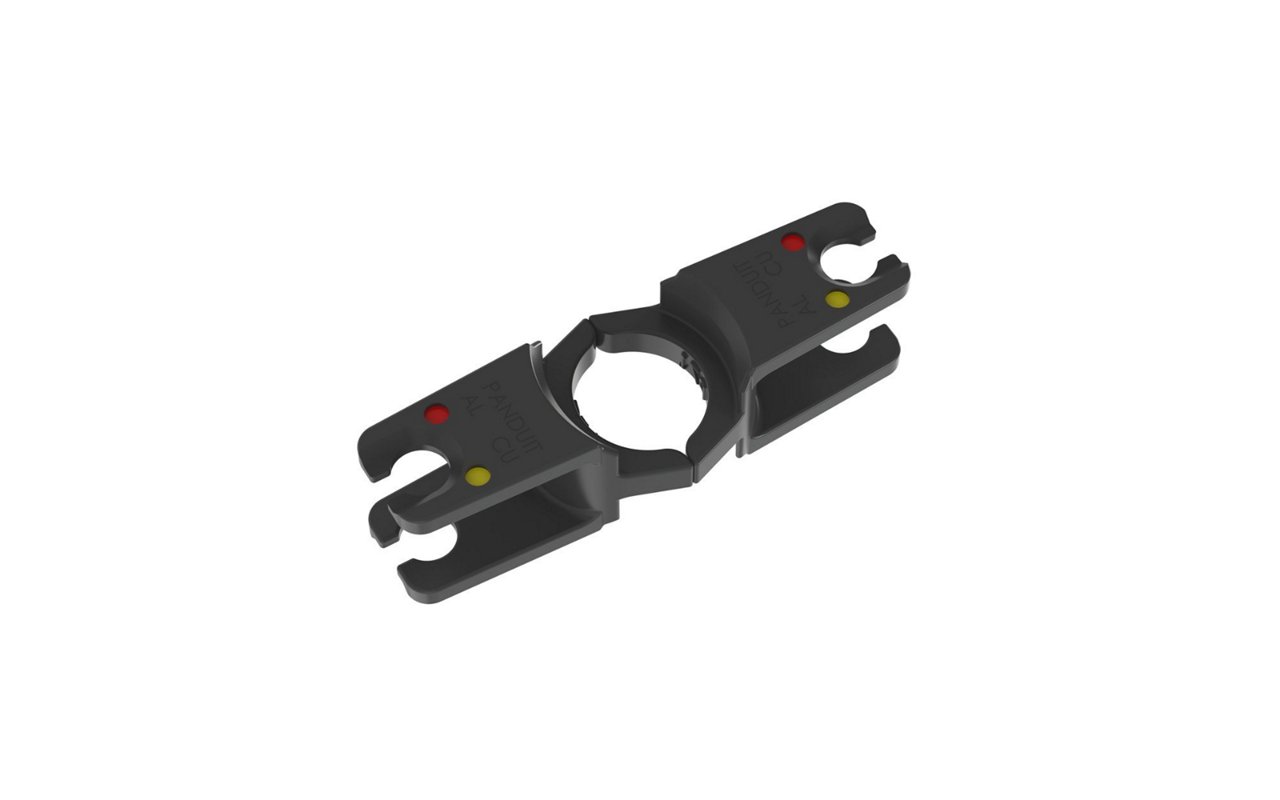 A black crimping tool die object with red and yellow dots