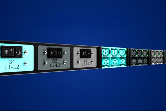 close-up of the el2p PDU, with aqua and grey receptacles against a dark blue background
