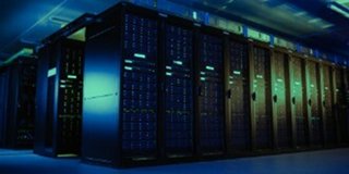Rows of illuminated server racks in a data center