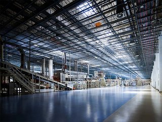 Modern manufacturing plant utilizing automated production systems and connected industrial infrastructure.