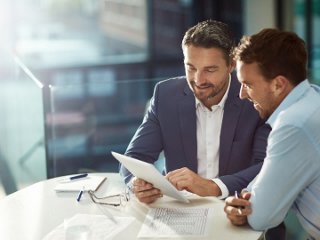 Two Data Center Managers walking through an AI-driven data center
