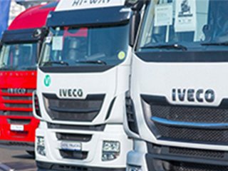 Front of trucks aligned at an angle with Iveco name on them