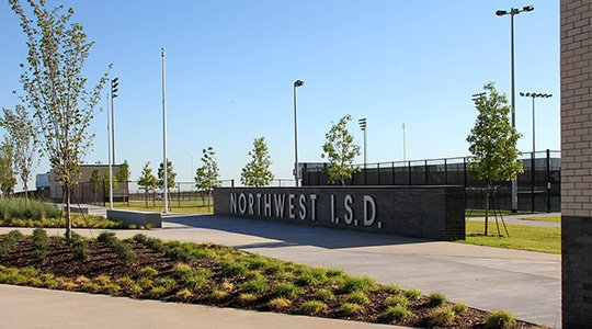 sign outside of a school and athletic fields showing Northwest ISD name