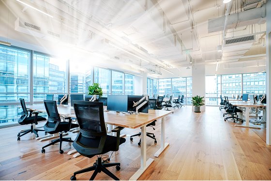 Interior of modern empty office building, open ceiling design.