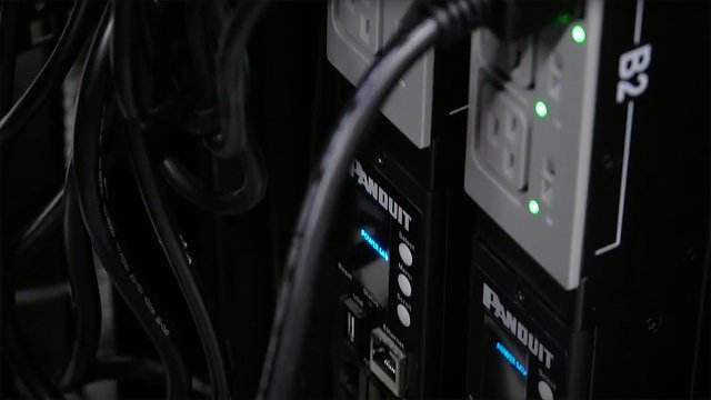 two Panduit PDUs in the rear of a data center cabinet in the Intesa Sanpaolo data center