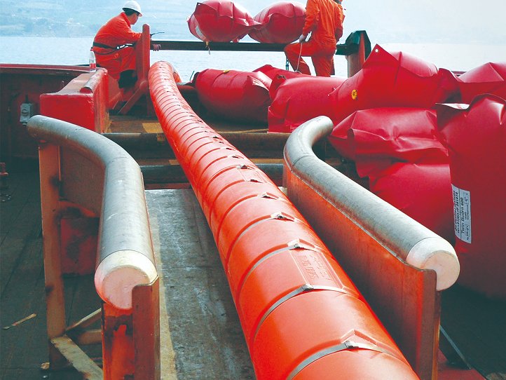 Construction worker laying down rebar