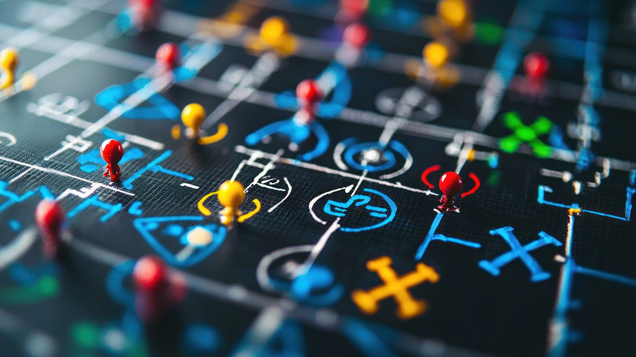 Abstract view of a playbook with brightly colored pins and markings on a dark canvas