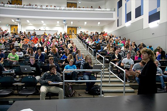 an instructor in front of a lecture hall full of students at purdue university