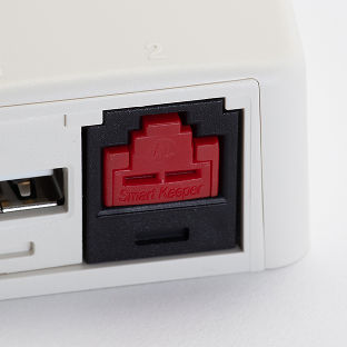 An Ethernet port, blocked by a physical security blockout device