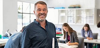 Students in classroom using laptop computers