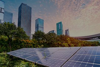 Solar panels on roof of building surrounded by skyscrapers