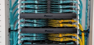 Panduit AI cabinet is shown with structured cabling