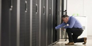 Data Center manager checks inside the cabinet for the organization’s on-premises environment