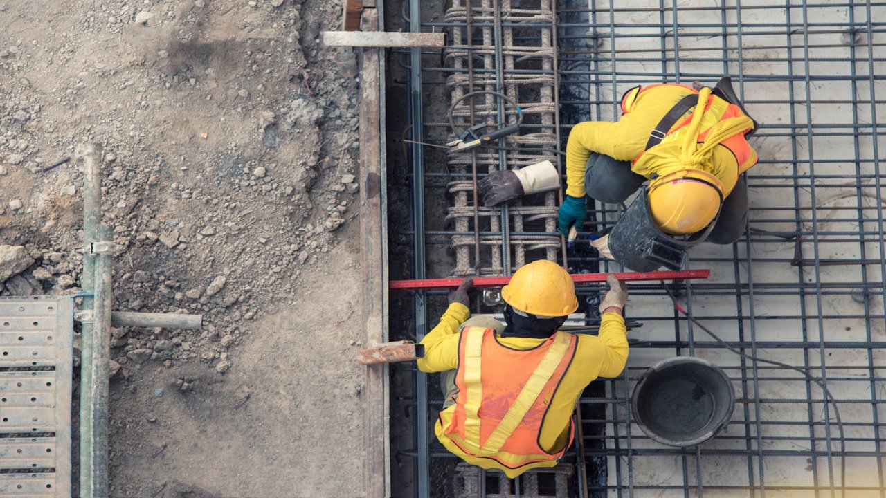 Construction workers in a grounding environment terminating wires