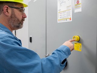 Electrical working performing test on control panel with verisafe