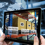 Tablet scanning bar codes in an automated warehouse environment