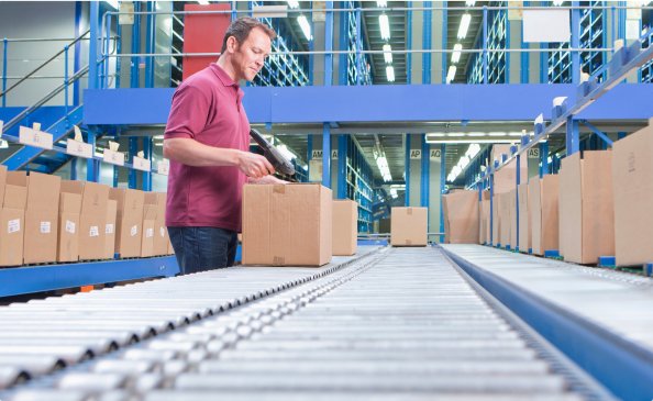 Packages moving down a conveyor belt