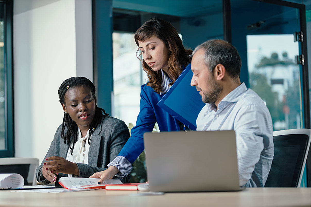 A finance team using spend management software in the workplace.