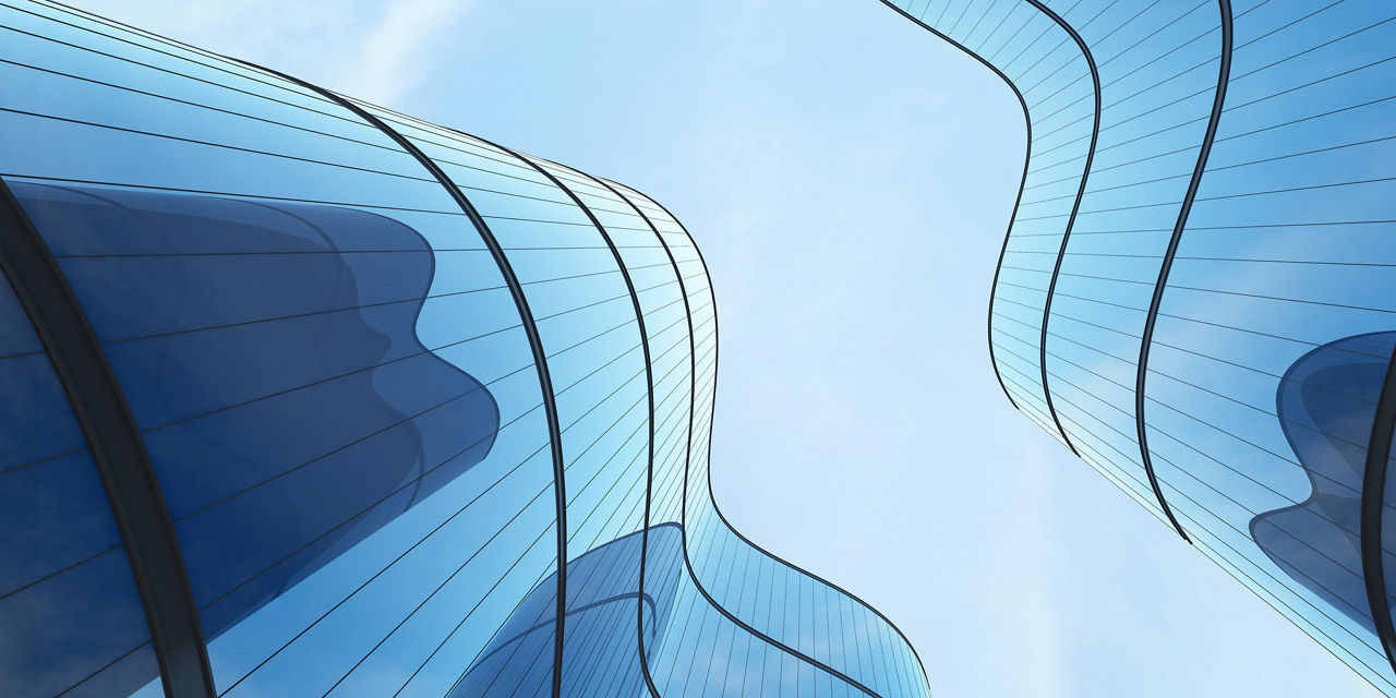 Photograph of of abstract buildings taken looking up between them