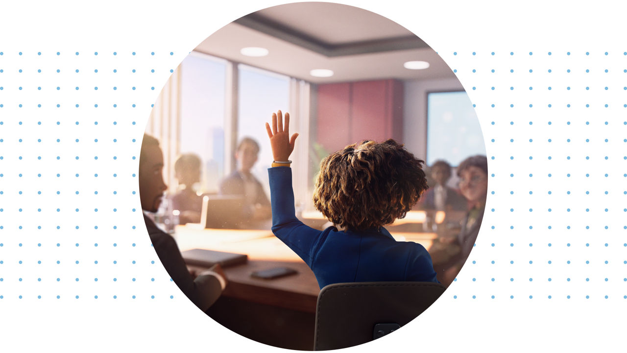 Woman raising hand in a meeting room.