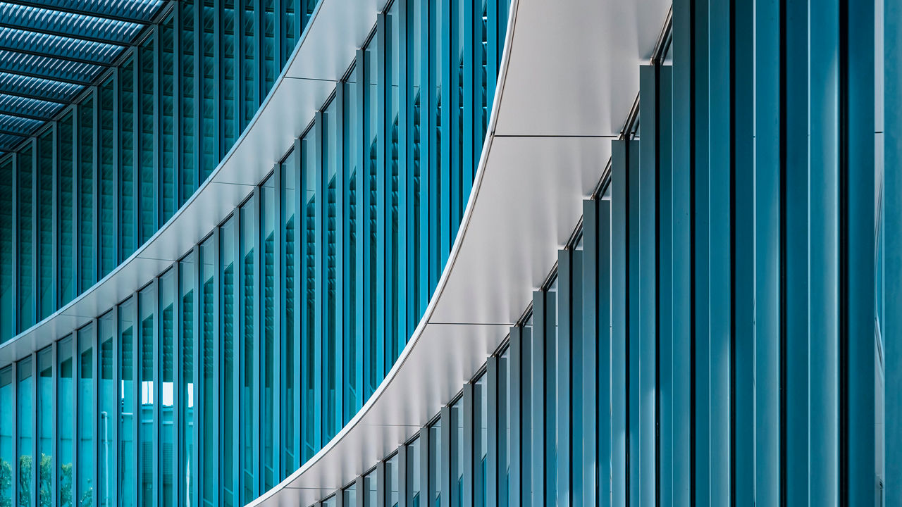 Architecture detail Modern Building Glass facade wall curve pattern Exterior
