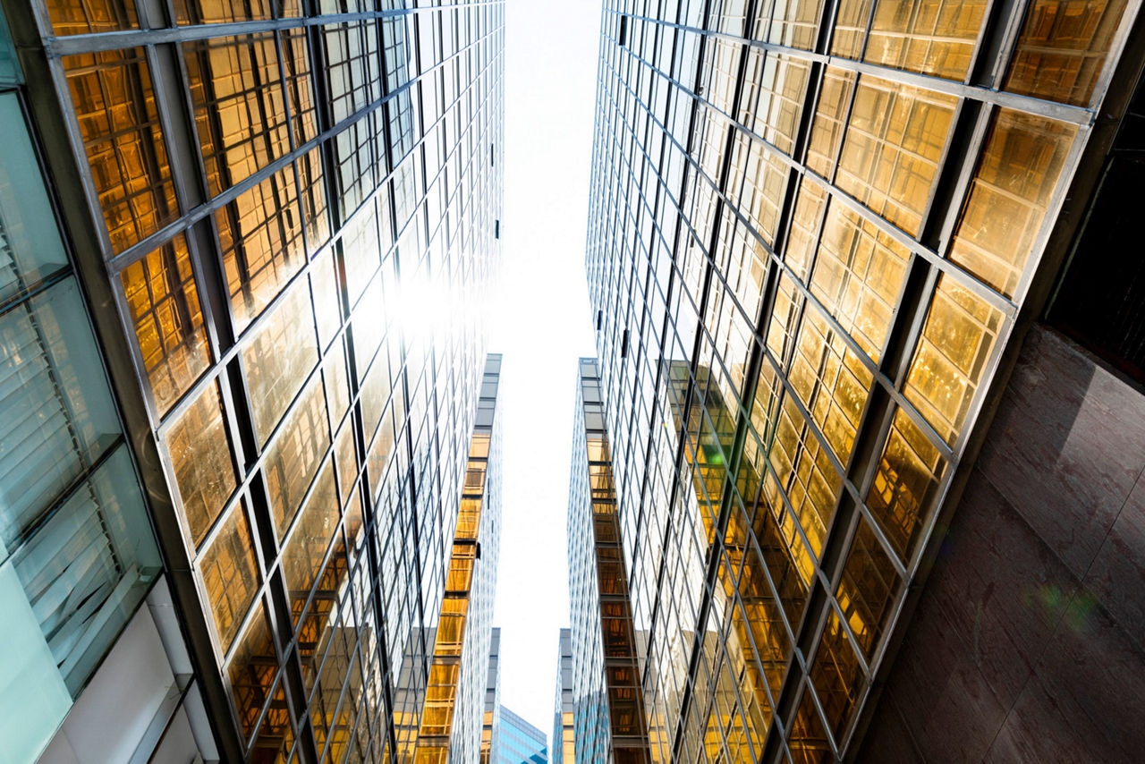 Looking modern office building from below.