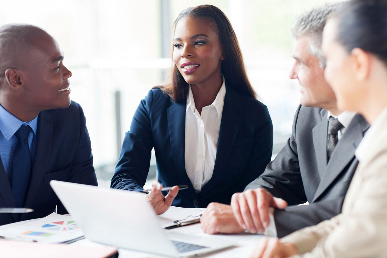 group of businesspeople having a meeting in modern office