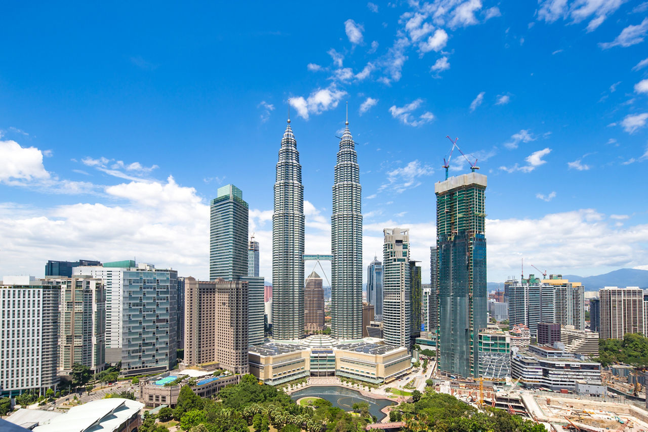 modern buildings in midtown of kuala lumpur in blue cloud sky from high angle