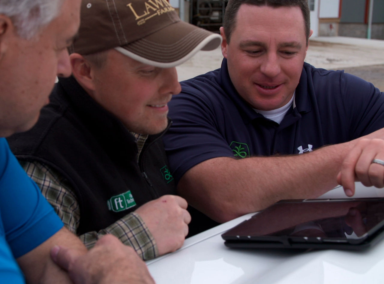 Lawnel family looking at tablet