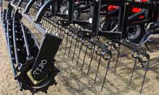 Using packers to firm seedbeds.