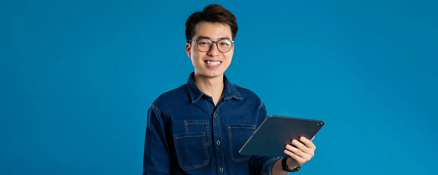 A businessman holding a pad with smile