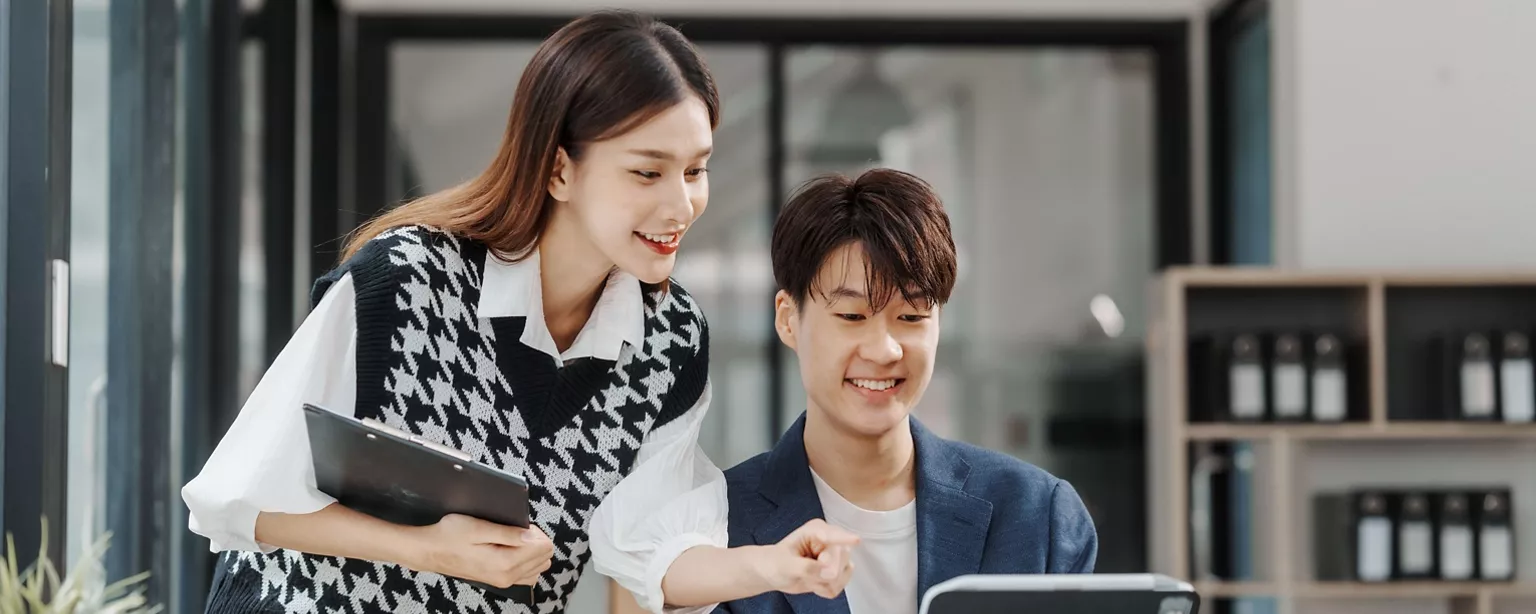 A man and a woman talking about job in the office