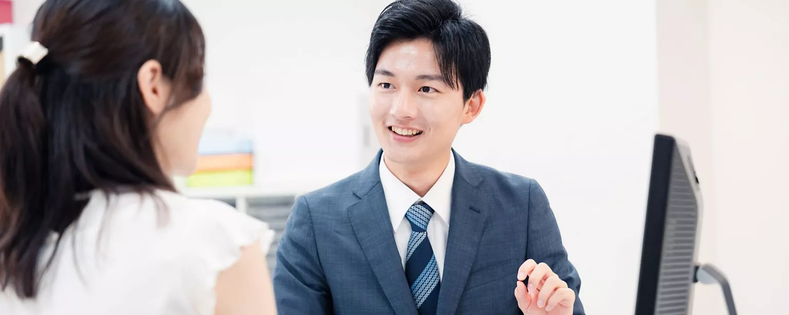 A businessmen discussing with a female team member