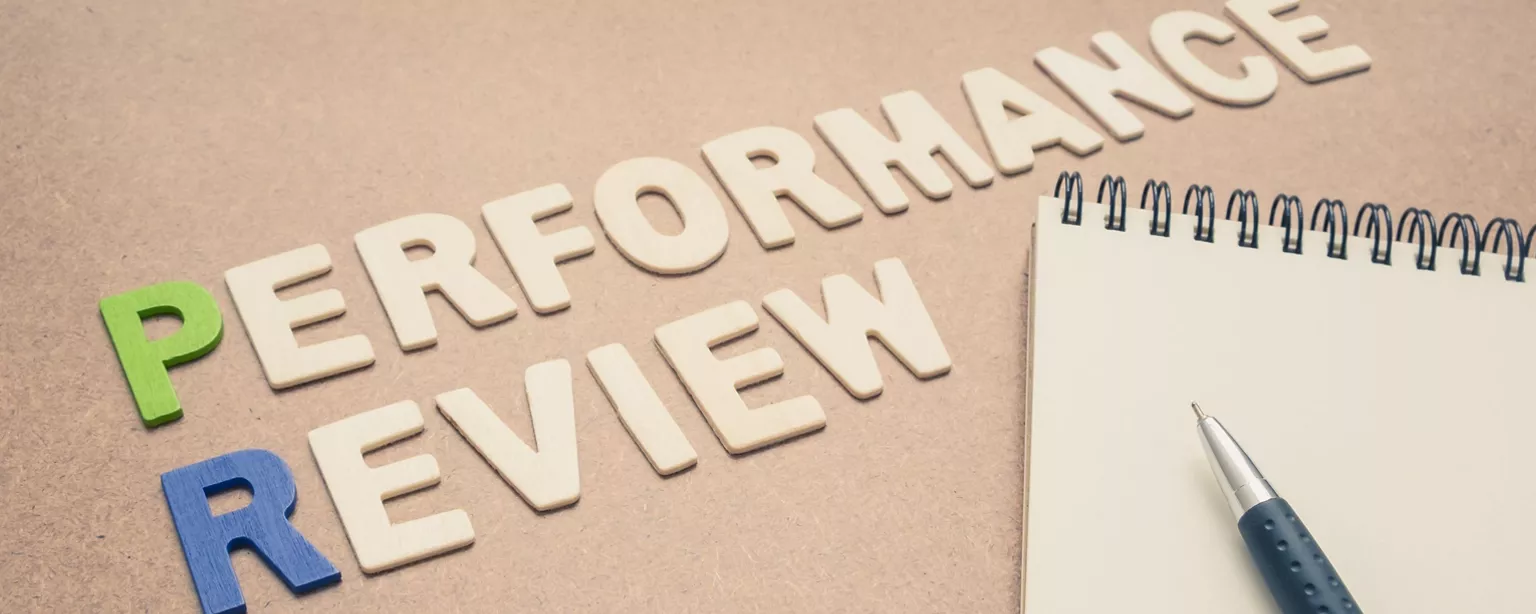 performance review, a notebook and a pen