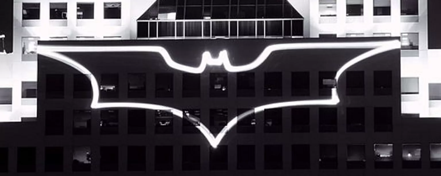 Lights on building in shape of a bat, comparing Batman to business analyst