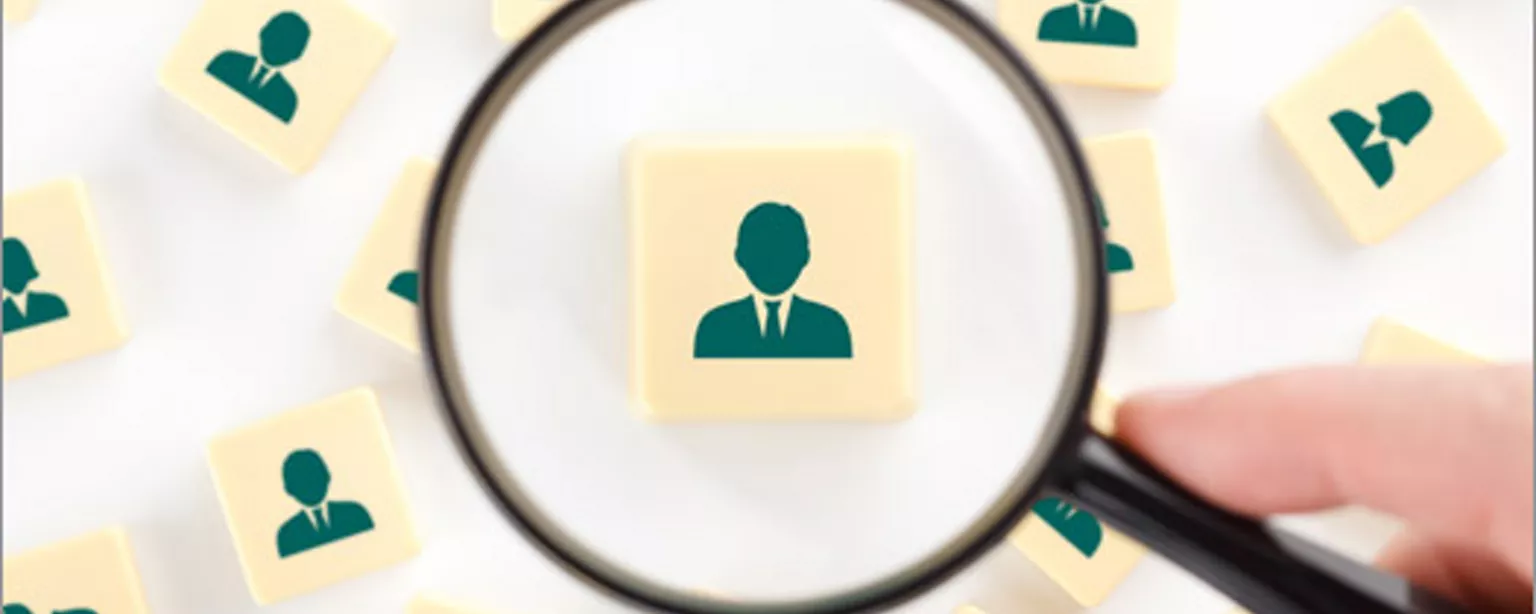 When Is It Time to Hire a Company Controller? — magnifying glass looking at illustrations of people