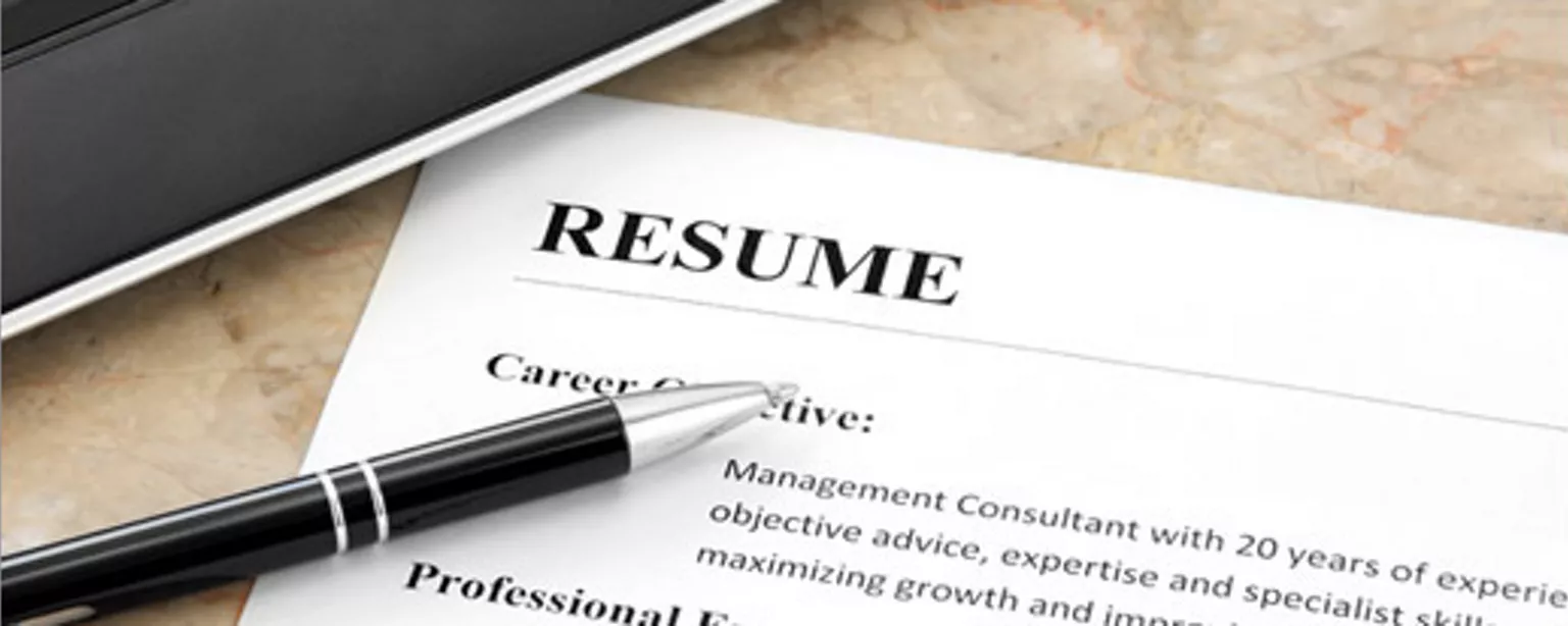 Resume and a pen to demonstrate best resume writing tips