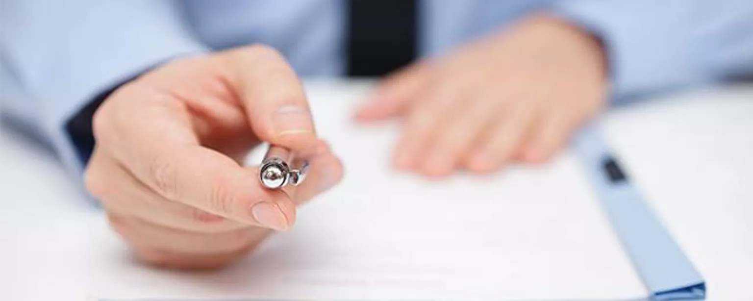 Closeup of hand with pen of man working in accounting operations