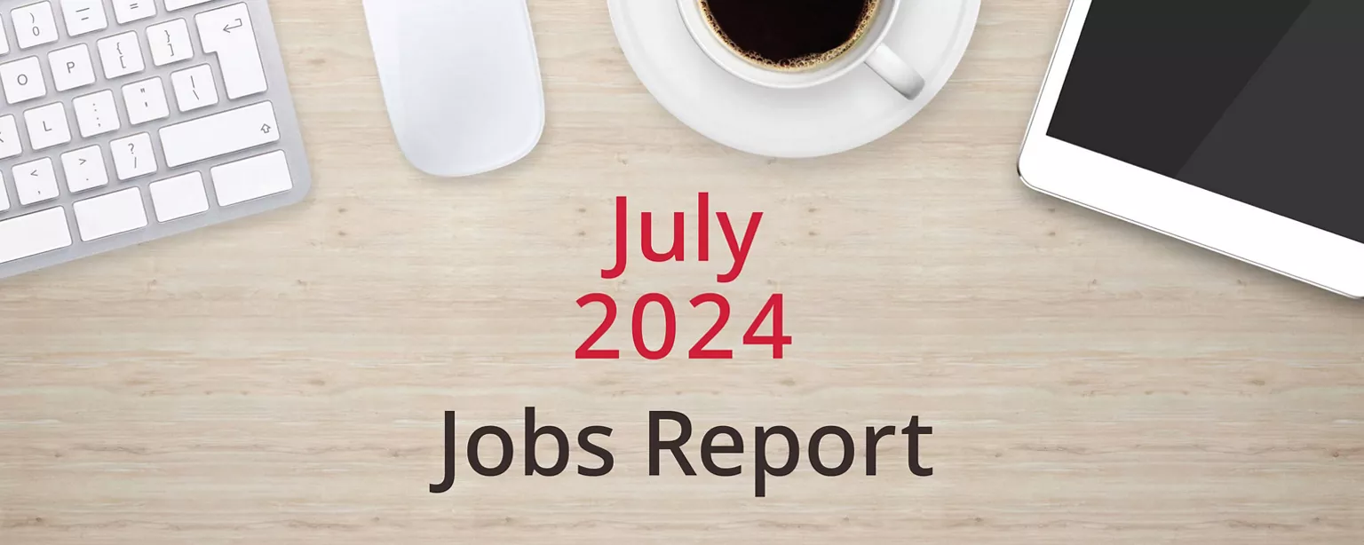 On a wooden desktop, positioned below a keyboard, mouse, cup of coffee and a tablet computer, are the words, "July 2024 Jobs Report."