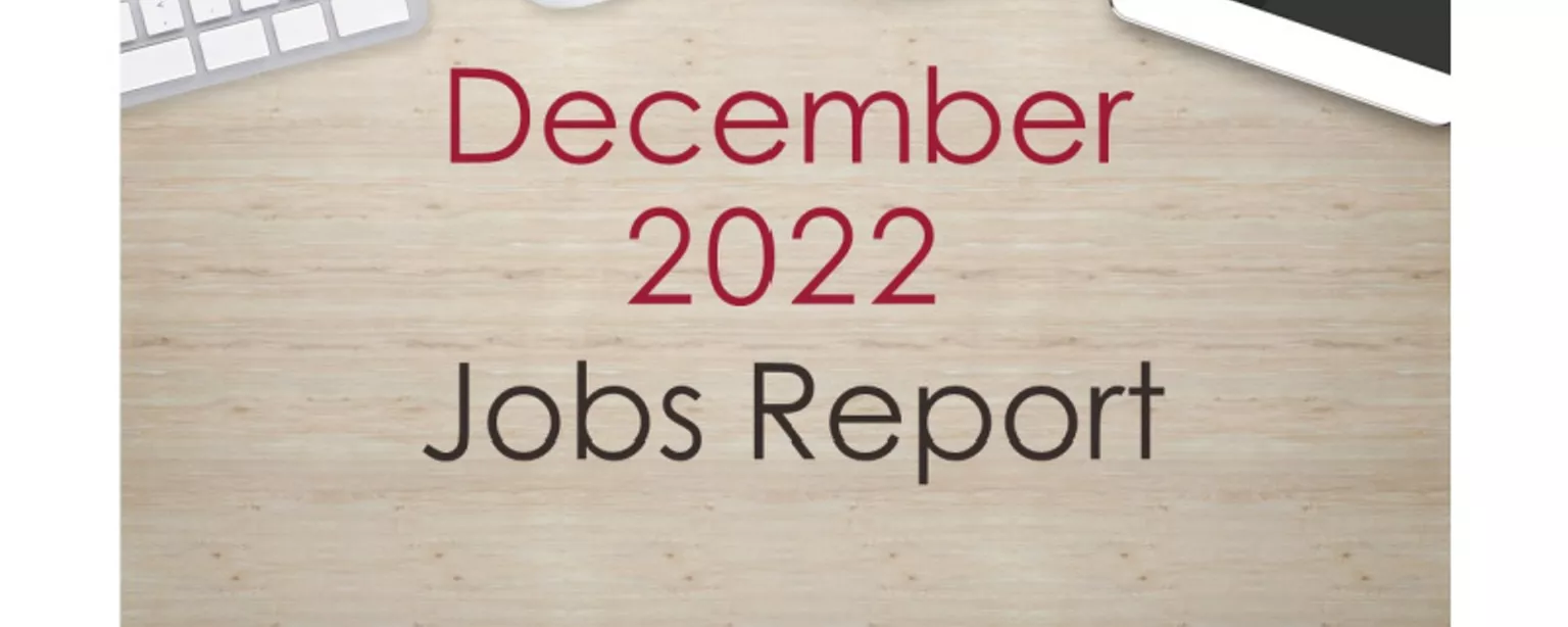 Desktop with keyboard, tablet and coffee cup, with text that reads: December 2022 Jobs Report.