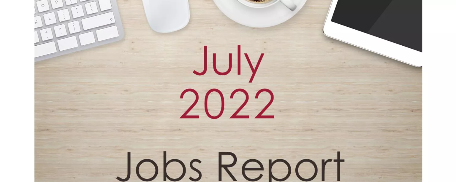 Desktop with keyboard, tablet and coffee cup, with text that reads: July 2022 Jobs Report.