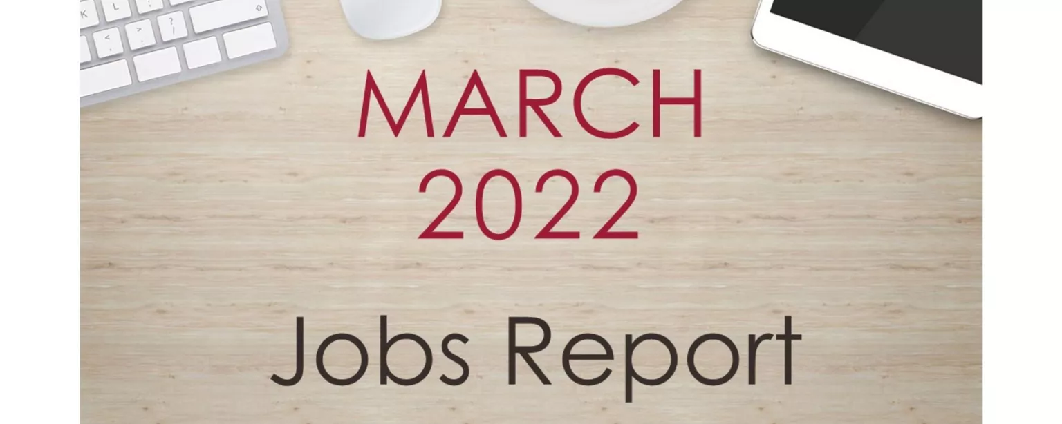 Desktop with keyboard, tablet and coffee cup, with text that reads: March 2022 Jobs Report.
