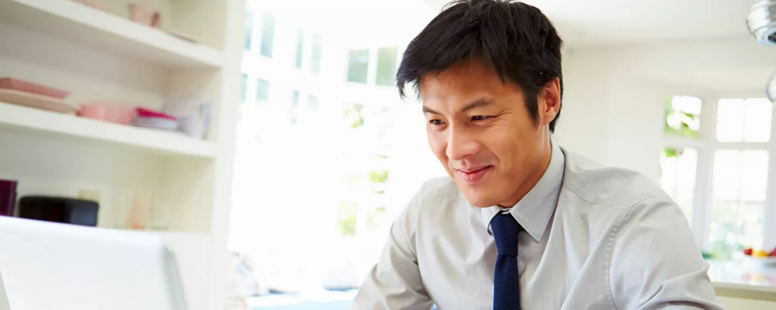 How to Land a Job Without Leaving Home — man at laptop doing digital job search