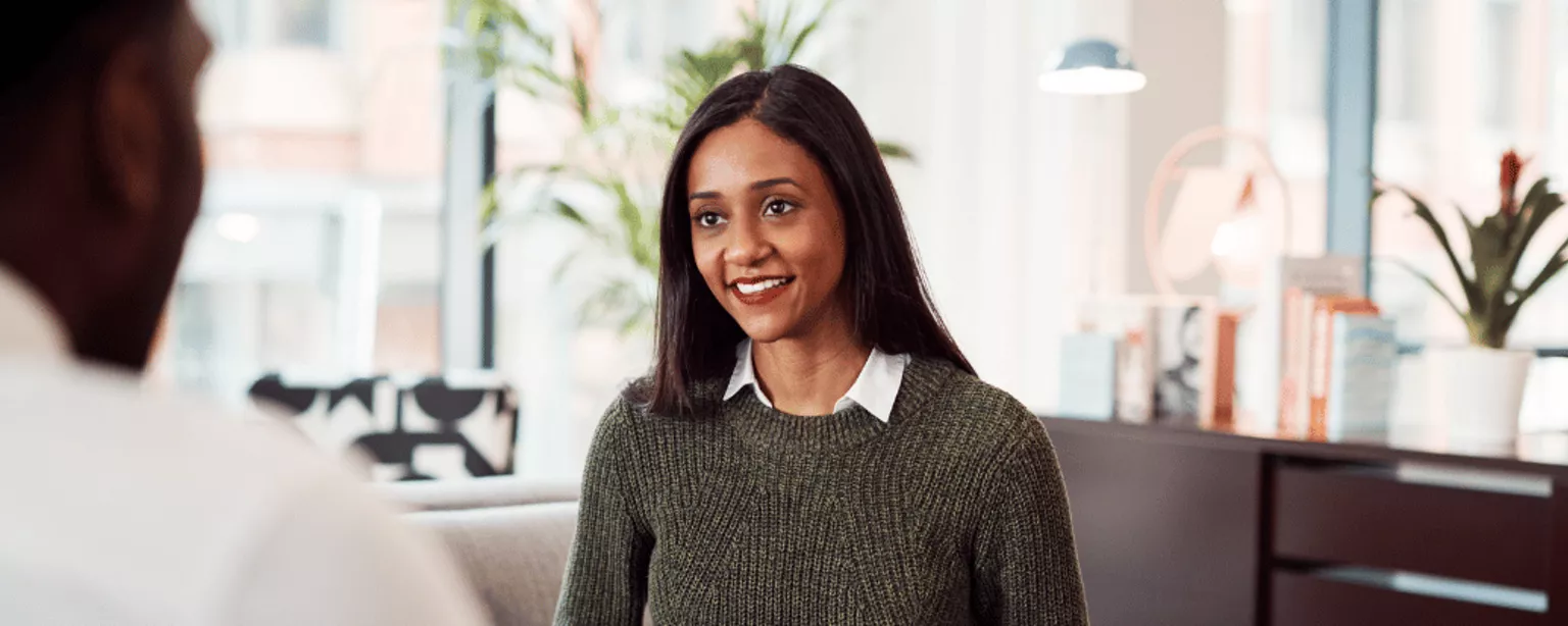 Woman sitting across from a man in an interview