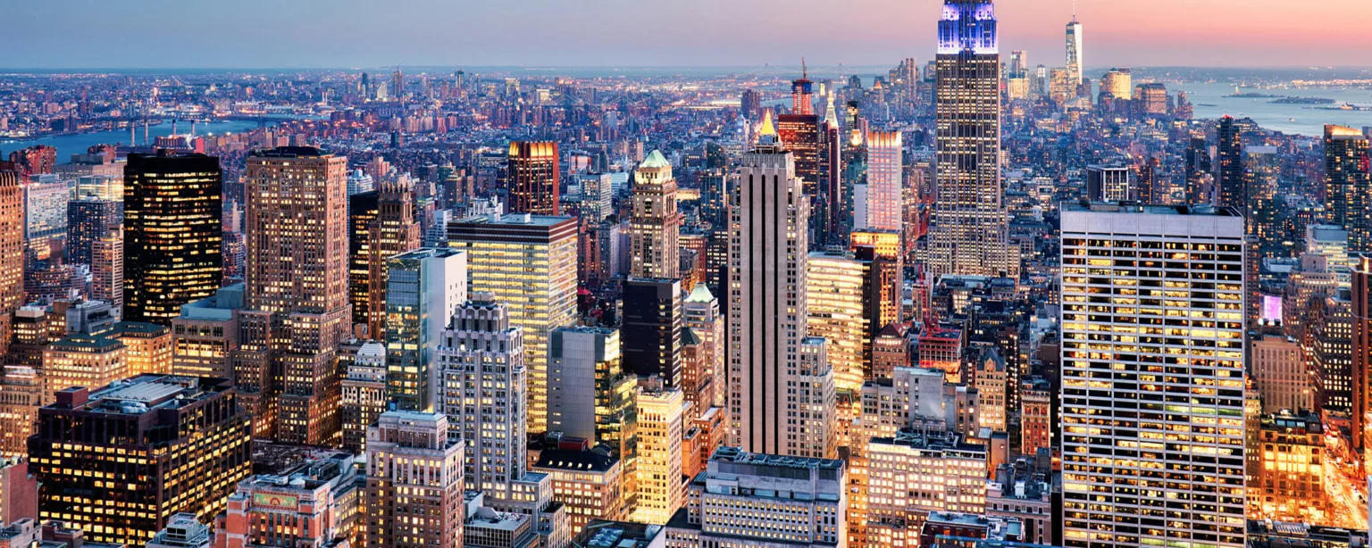 Executive Assistant Salary and Hiring Trends in New York City — Photograph of skyscrapers In New York City.